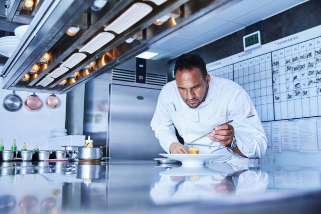 Chef Michael Caines prepares a dish with an EcoPro G3 cabinet in the background