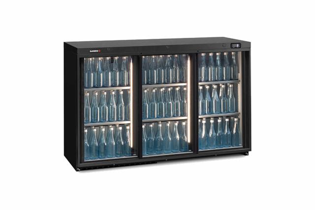 MG3315SD bottle cooler viewed from an angle, filled with empty bottles which are beautifully illuminated